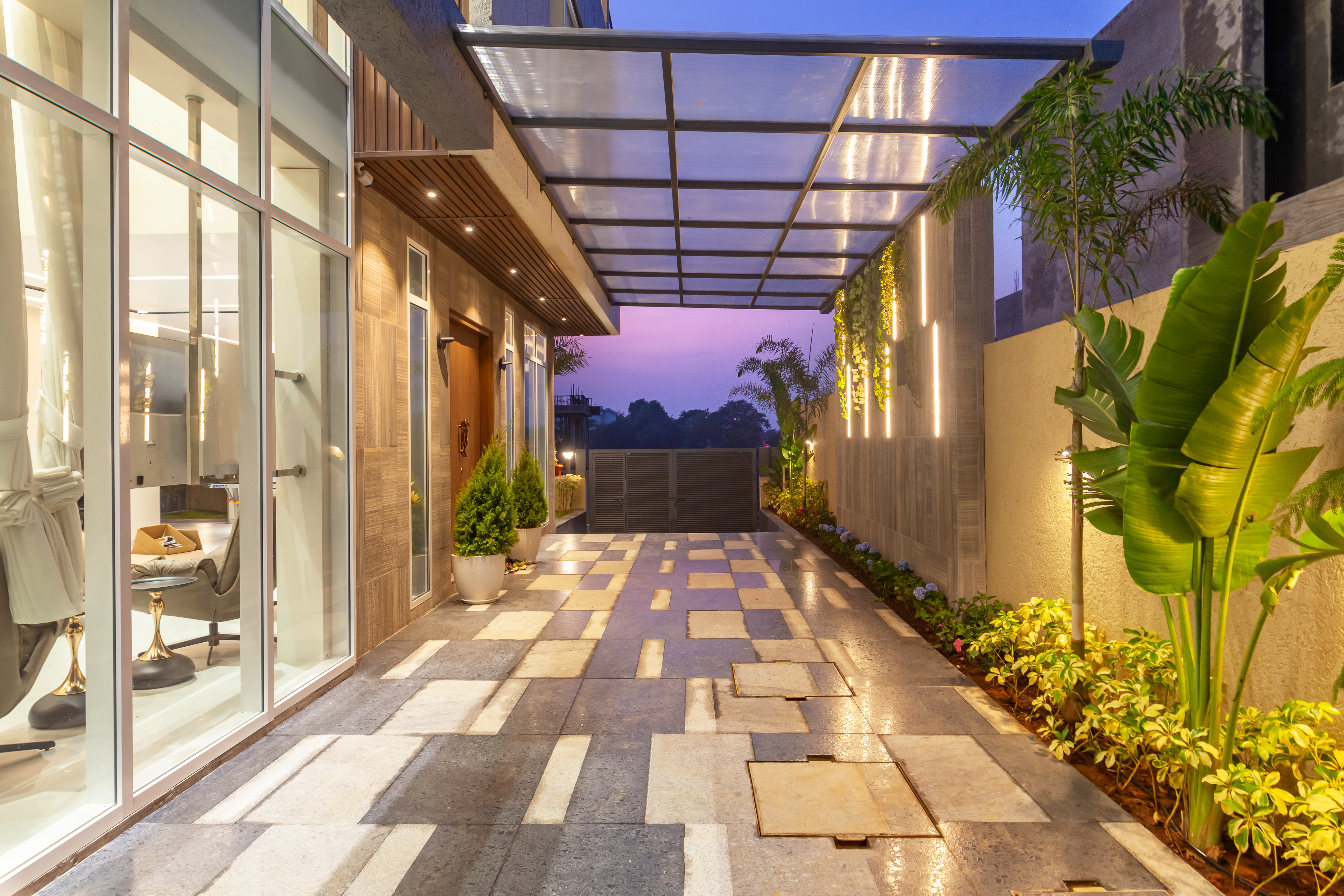 room-with-floor-to-ceiling-glass-window-ocean-view-sunset